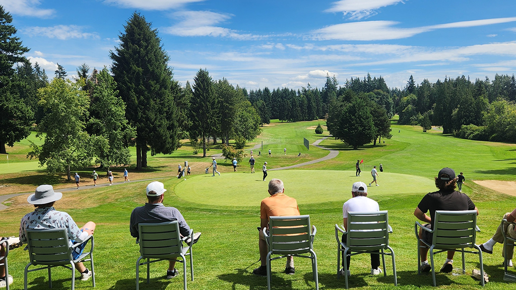 Players observing over golf course